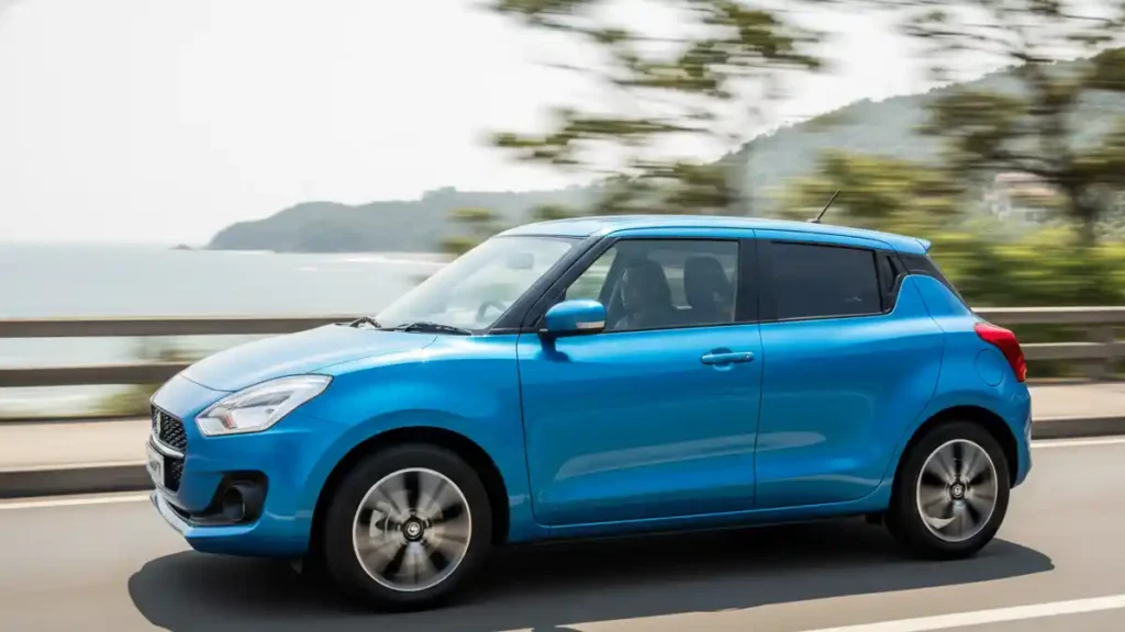 Side view of Maruti Suzuki Swift highlighting the alloy wheels and floating roof.