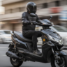 Okinawa Praise Pro electric scooter running on city road with rider.