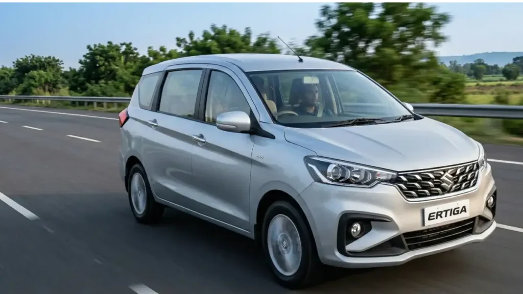 Maruti Suzuki Ertiga MPV running on a highway with a driver.