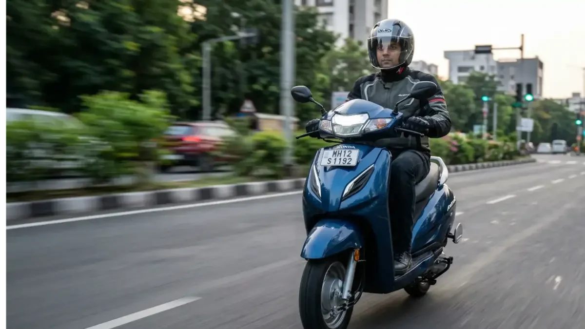 Honda Activa 6G running on a city road with a rider.