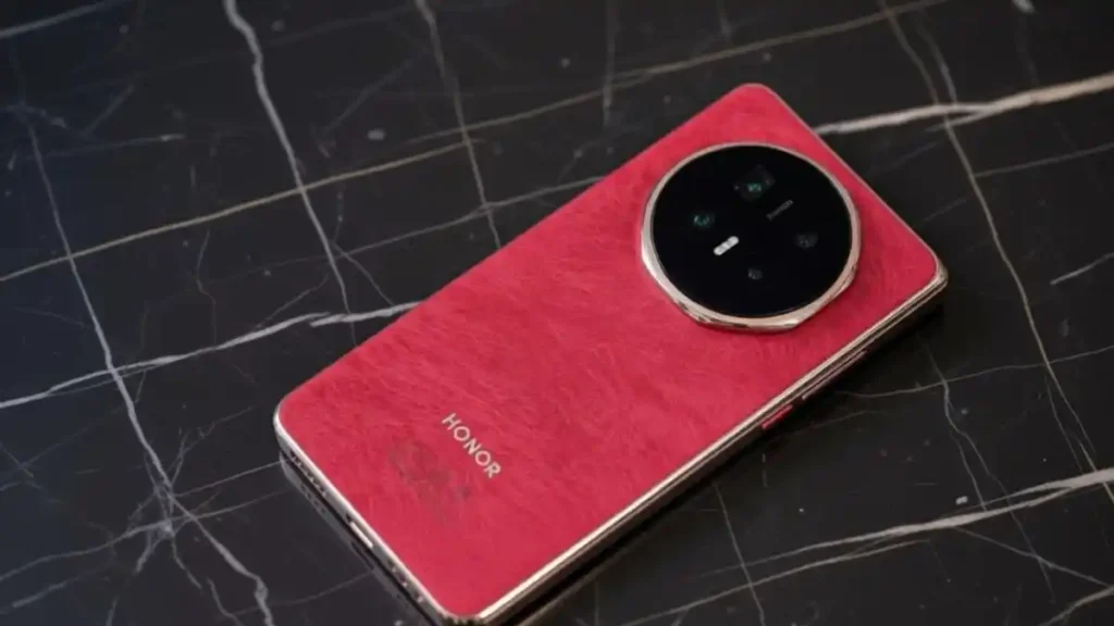 Rear camera setup of folded Honor Magic V6 on a stylish desk.