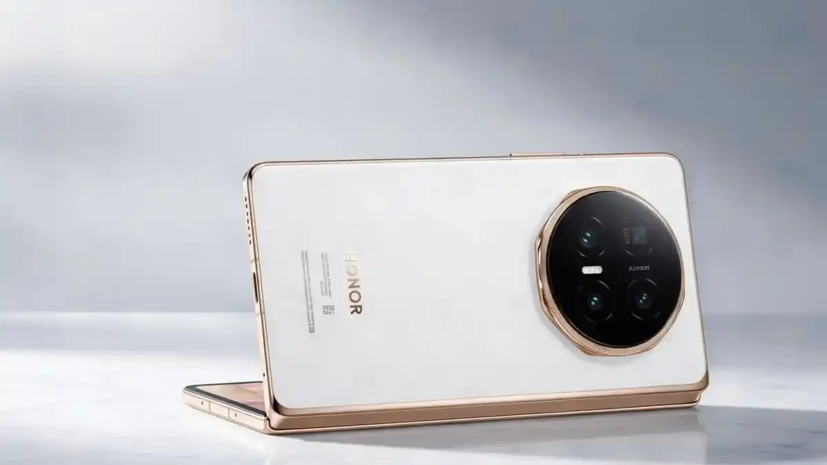 Honor Magic V6 foldable phone shown folded on a stylish desk.