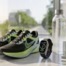 Fitness gear and a smartwatch on a stylish desk representing the start of a healthy morning routine.