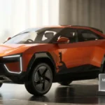 Mahindra BE 6 Electric SUV on a stylish desk showcasing its futuristic coupe design.