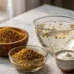: Dry and soaked fenugreek seeds with a small cup of yogurt arranged on a stylish desk representing organic hair care ingredients.