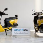 Ather Rizta Electric Scooter on a stylish desk showcasing both front profile and rear family seat design.