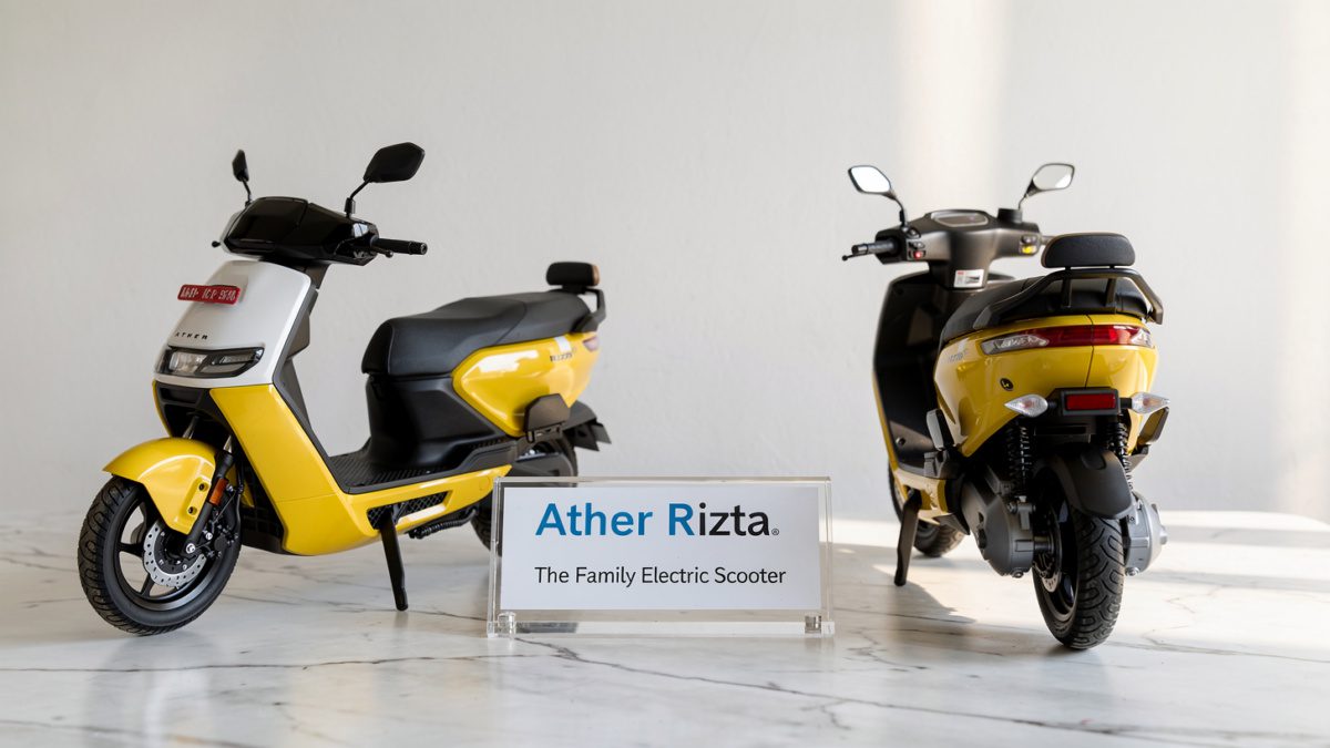 Ather Rizta Electric Scooter on a stylish desk showcasing both front profile and rear family seat design.
